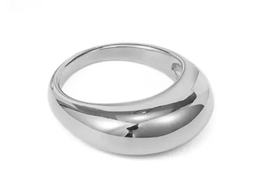 Polished silver dome ring with smooth modern design on a white background