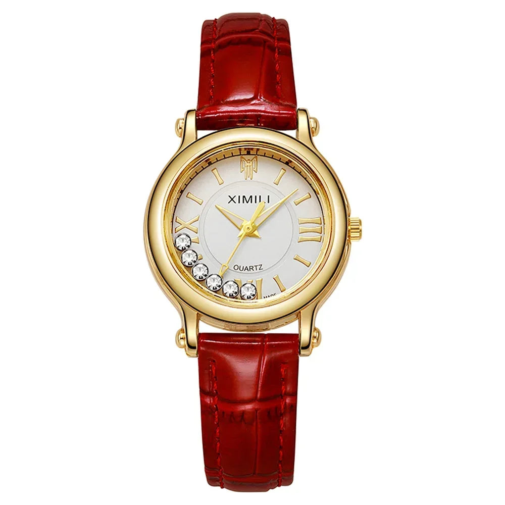 Elegant women's gold-tone wristwatch with red leather strap and crystal accents