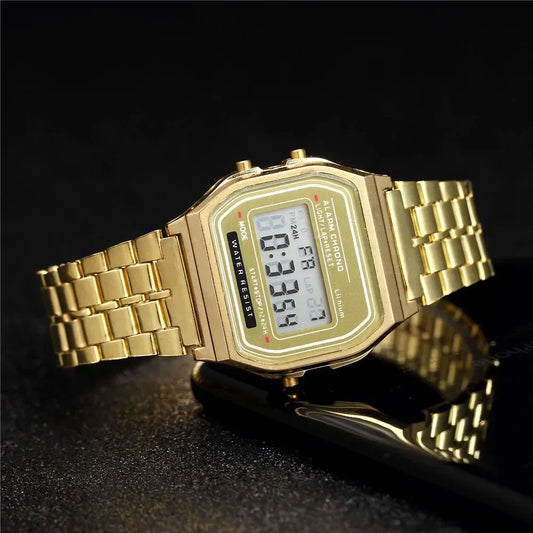 Gold digital wristwatch with metal band, classic rectangular face, quartz display, water resistant