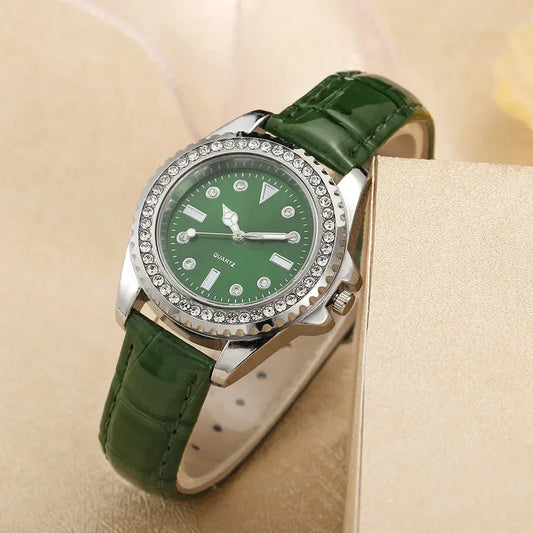 Green leather band women's wristwatch with rhinestone bezel and silver case