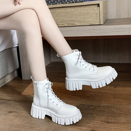 Trendy chunky white lace-up boots on woman, modern footwear from danastors fashion shop