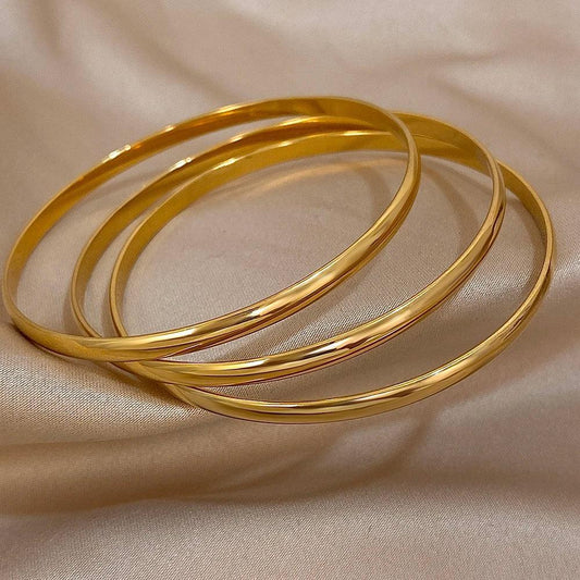 Brazalete rígido DANA de acero inoxidable y oro de 18 quilates