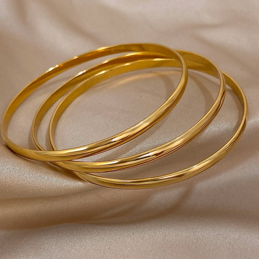 Brazalete rígido DANA de acero inoxidable y oro de 18 quilates