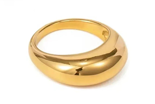 Chunky gold dome ring with smooth polished finish on white background, modern jewelry