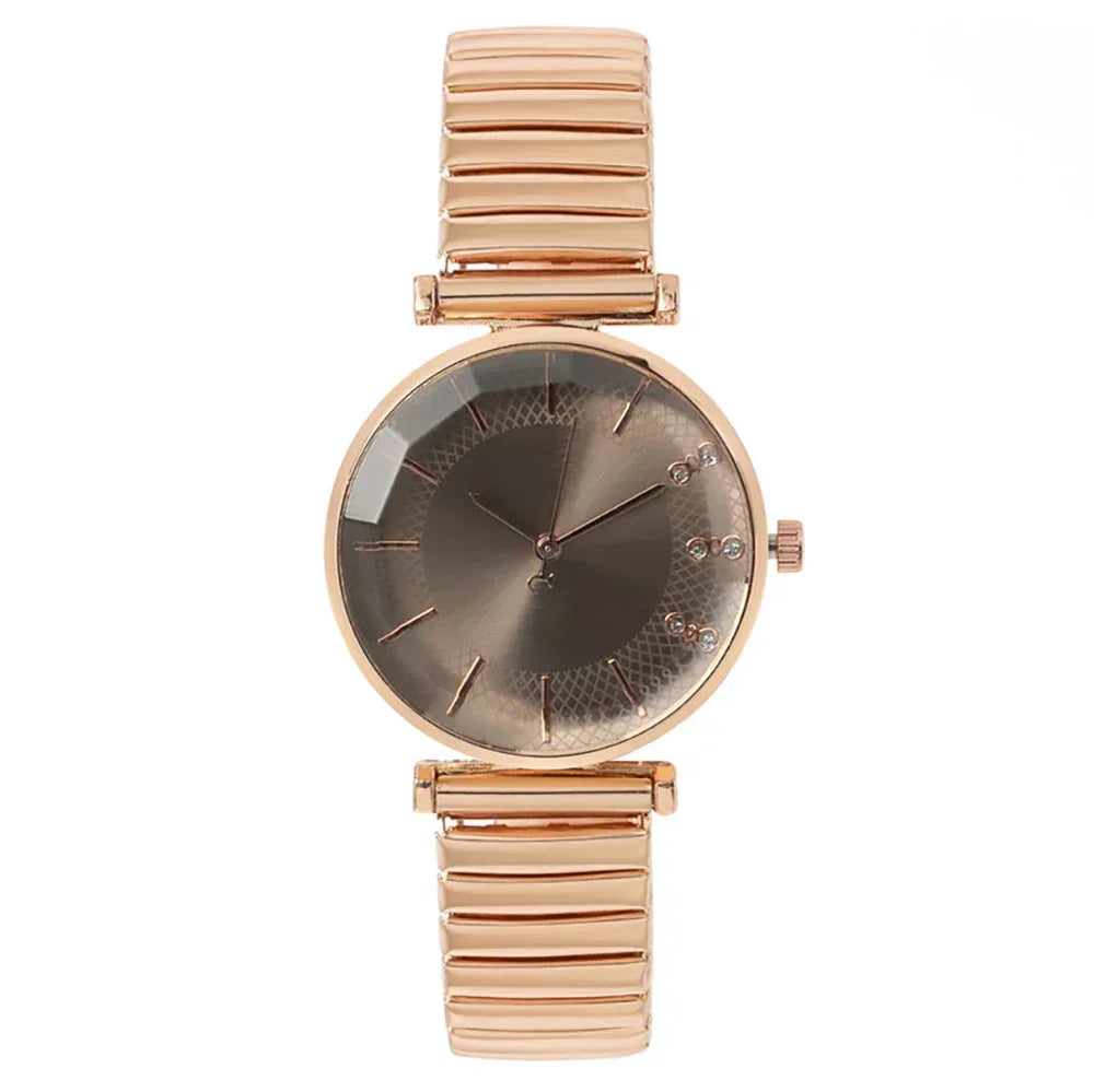 Elegant rose gold wristwatch with a metallic strap and minimalist dark dial design