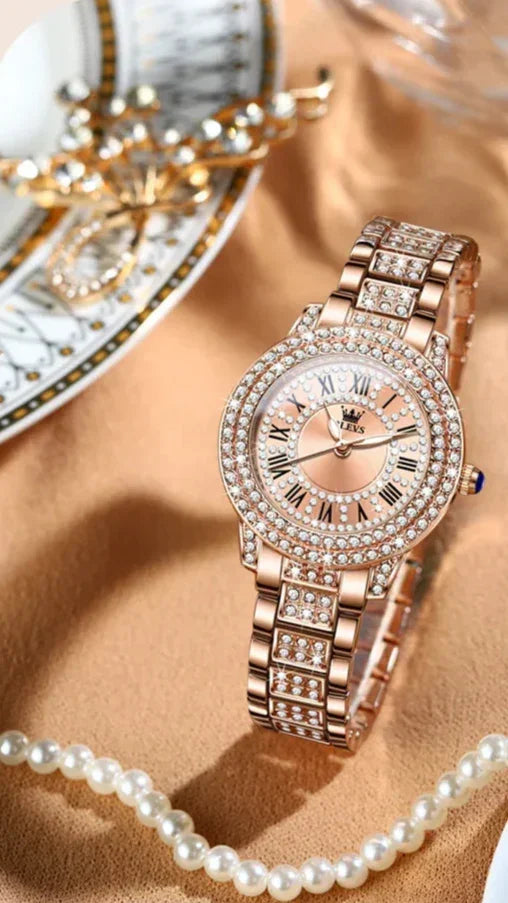 Elegant rose gold women’s wristwatch with crystals, roman numerals, and pearl accents
