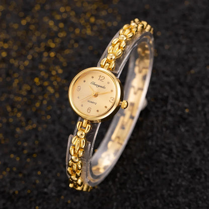 Reloj de aleación con cristal dorado y esfera pequeña