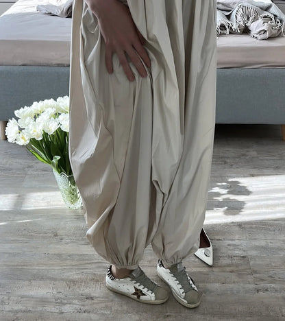 Pantalones de tiro alto y pierna ancha con bolsillos