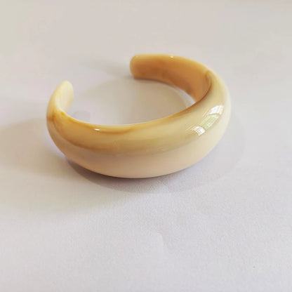 Exaggerated Jelly Colored Curved Cuff Bracelets