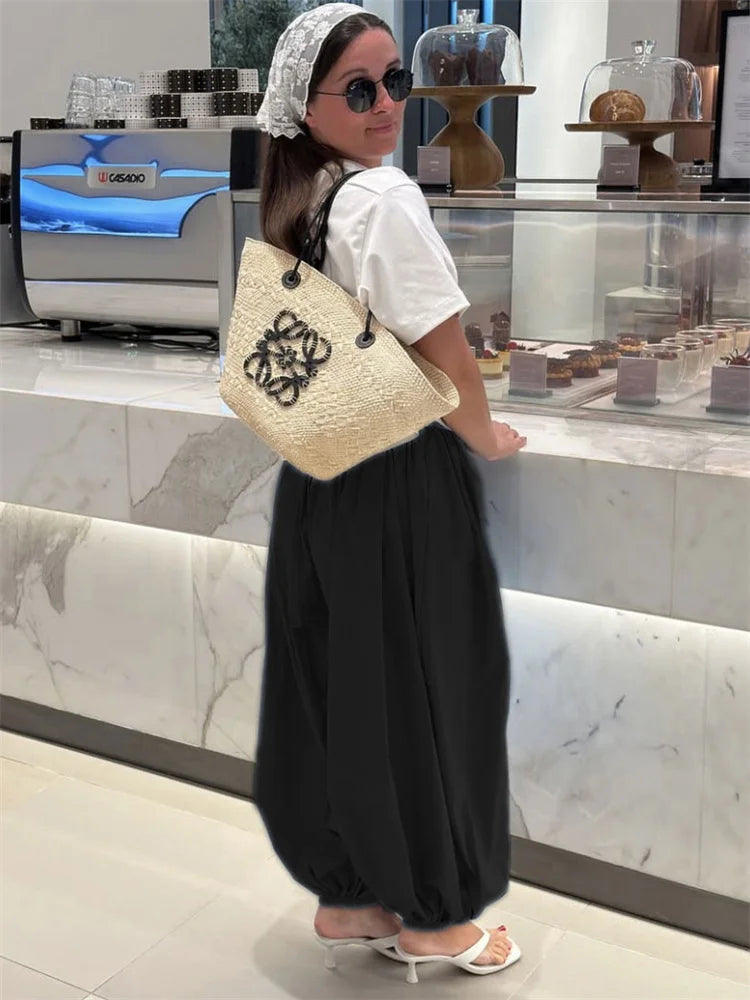 Pantalones de tiro alto y pierna ancha con bolsillos