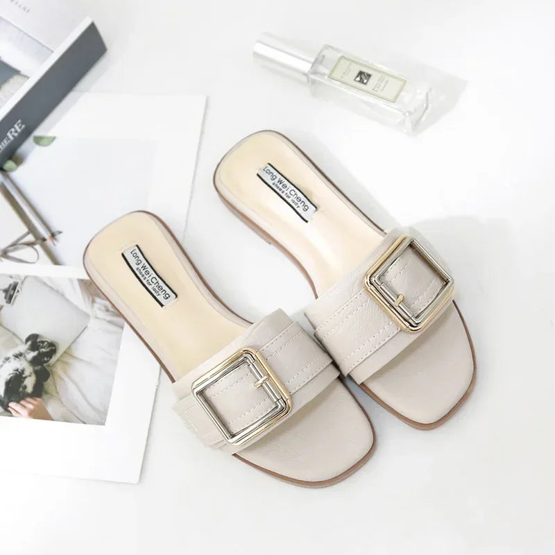 Beige slip-on sandals with square toes and large gold buckles, stylish women's footwear