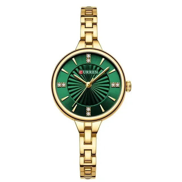 Gold women’s wristwatch with green sunburst dial and diamond hour markers