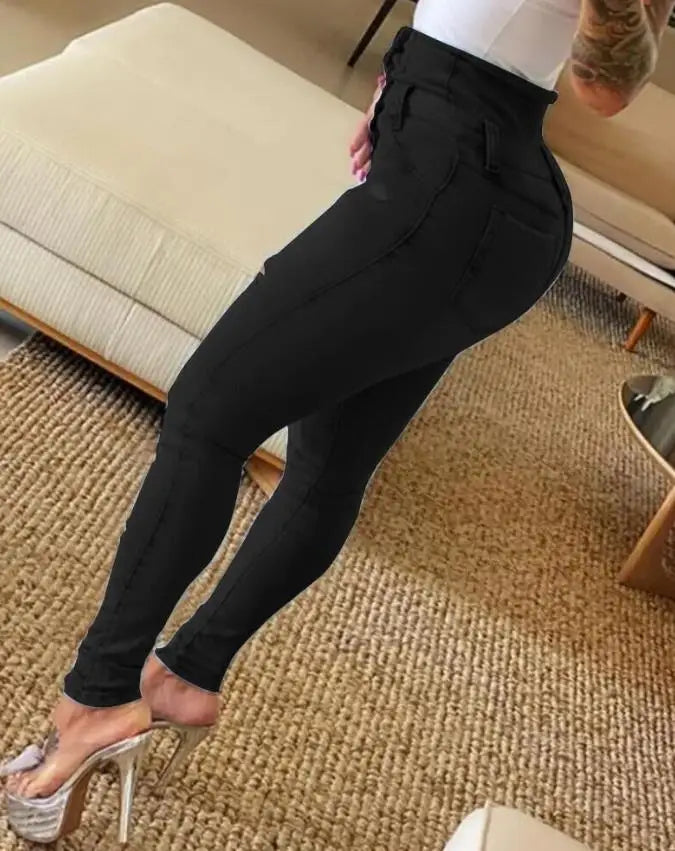 Jeans ajustados elásticos rasgados de cintura alta