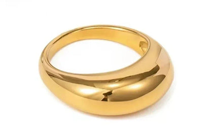 Chunky gold dome ring with smooth polished finish on white background, modern jewelry