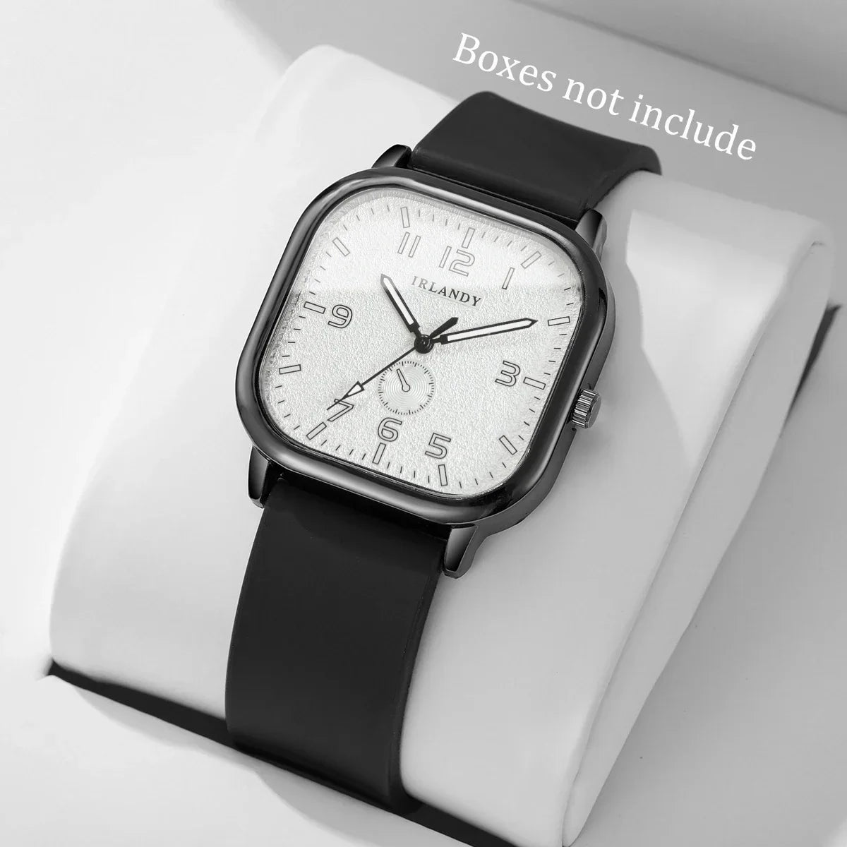 Modern square-faced wristwatch with black strap and white dial on display pillow at danastors.