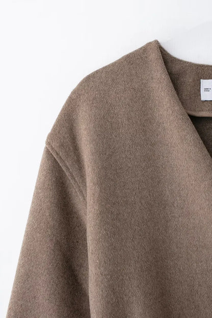 Chaqueta suave de manga larga con cuello en V y cinturón cruzado