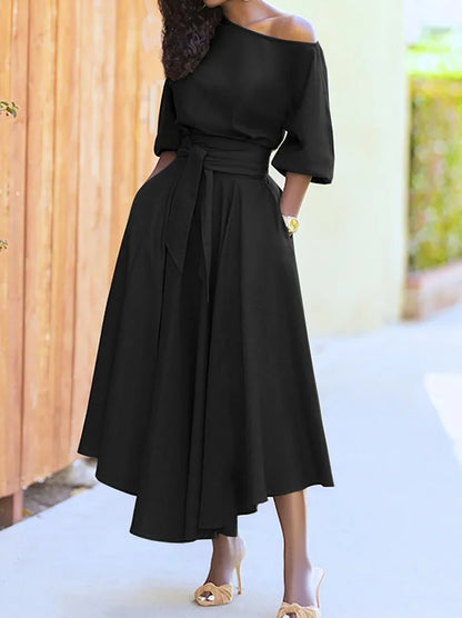 Vestido largo con cuello de hombros inclinados y cintura con lazo