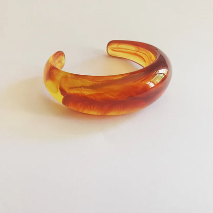 Exaggerated Jelly Colored Curved Cuff Bracelets
