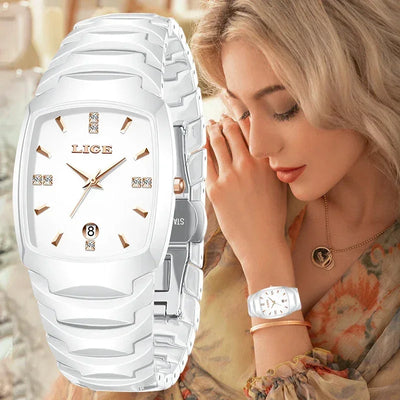 Elegant woman wearing silver luxury wristwatch with white face and gold accents
