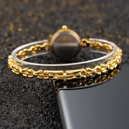 Reloj de aleación con cristal dorado y esfera pequeña