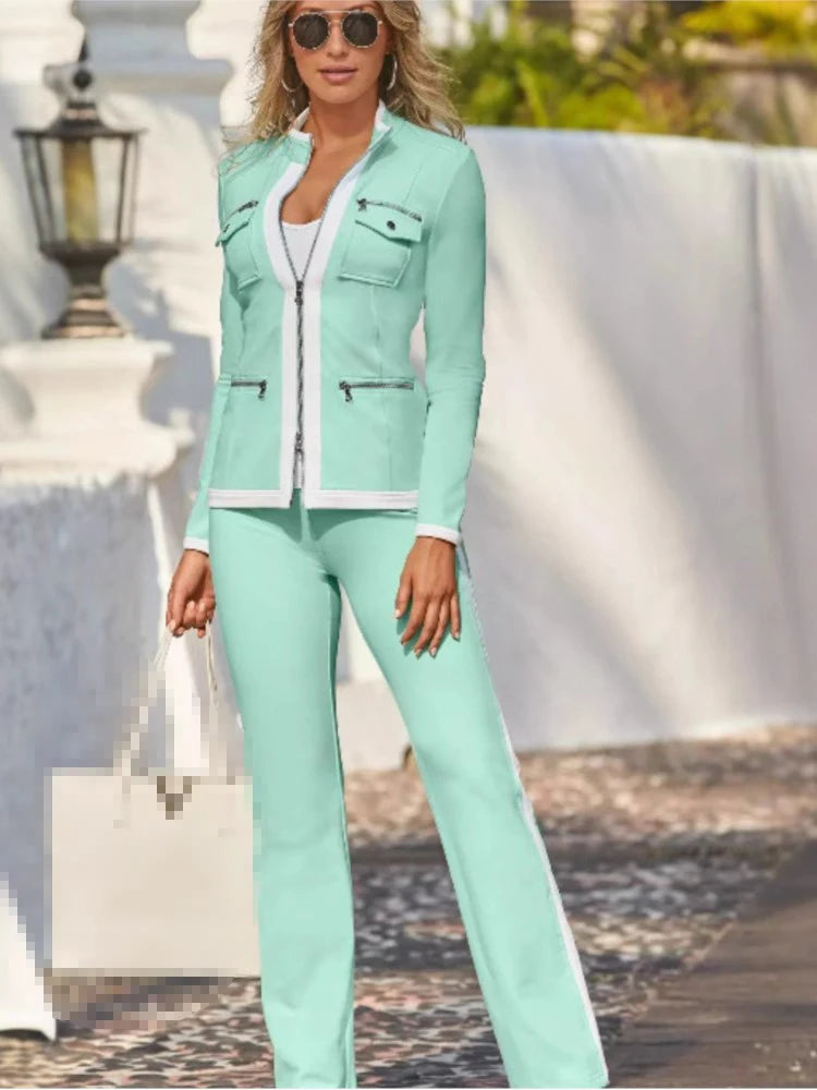 Conjunto elegante, ajustado y sencillo de pantalón deportivo recto con cremallera y top.