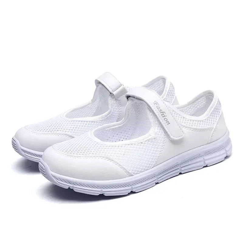White mesh breathable Mary Jane sneakers with Velcro strap on a white background