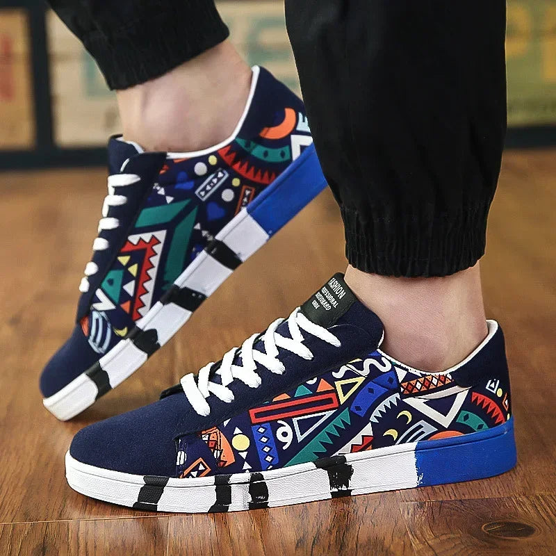 Colorful geometric print low-top sneakers with white laces on wooden floor